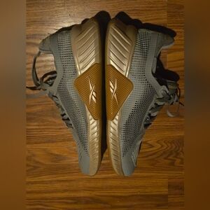 Size 10 Reebok Womens Gray and Goldish Colored Sneakers. Breathable Mesh.